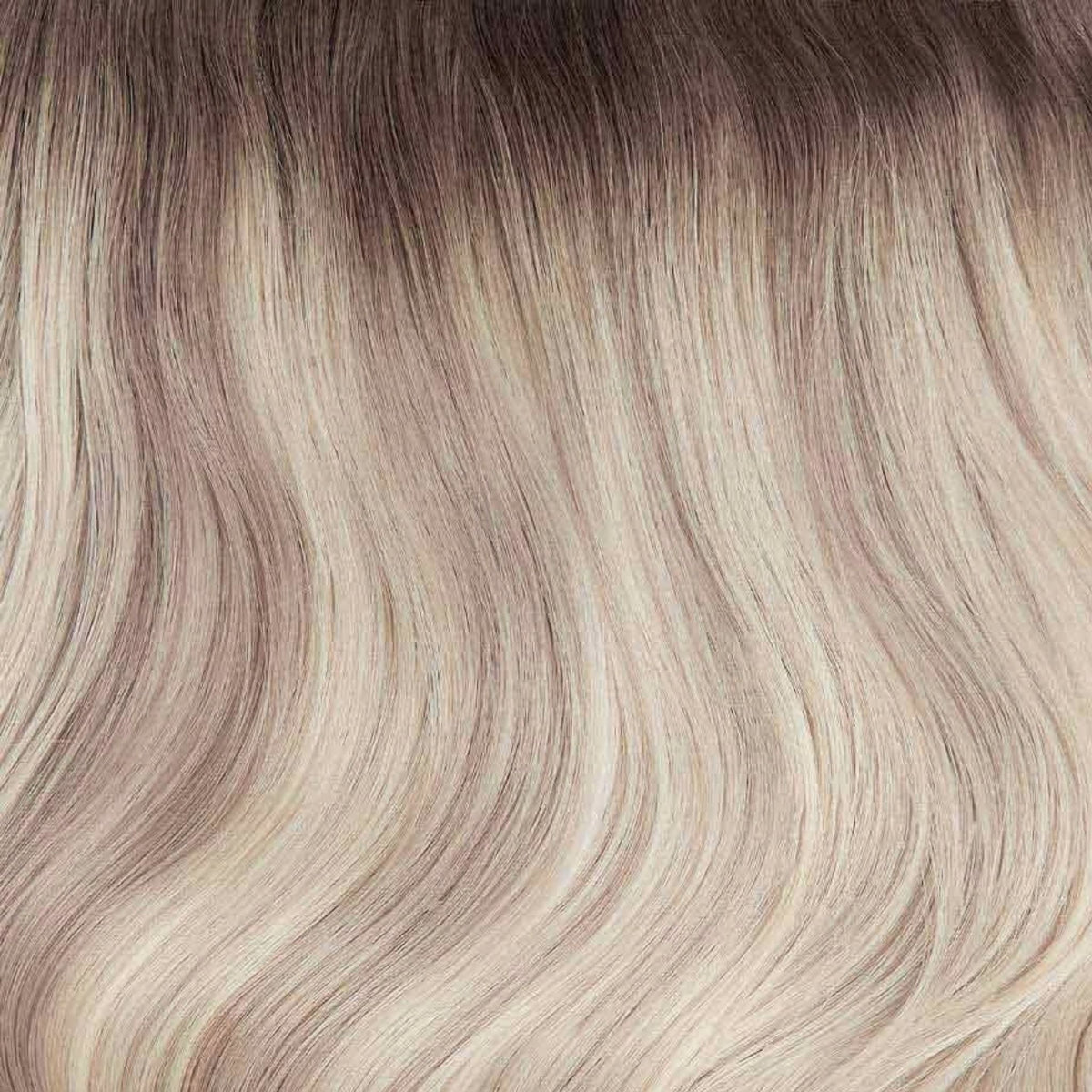 Melena larga con ondas y extensiones adhesivas rubio balayage